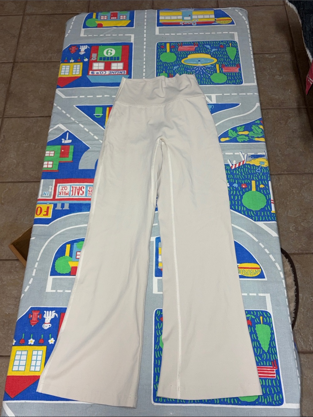 Cream flare pants with no front seam